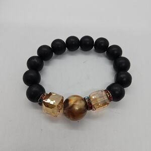 chunky black beaded stretch bracelet with orange crystal and brown swirl beads